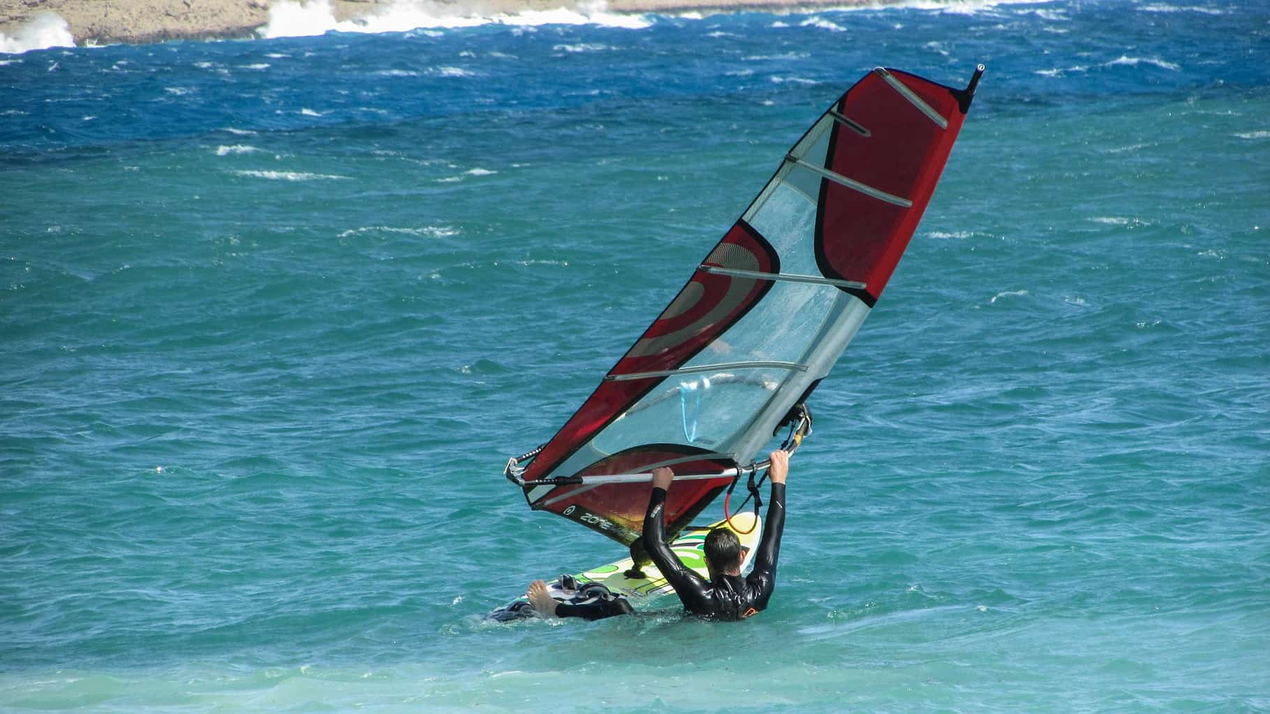 Is Windsurfing Harder Than Surfing? (Honest Comparison)